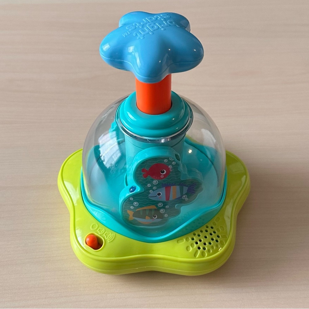 Bright Stars Press and Glow Spinner baby toy